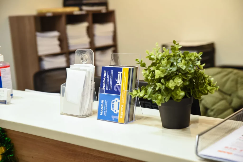 Business Cards and plant on desk